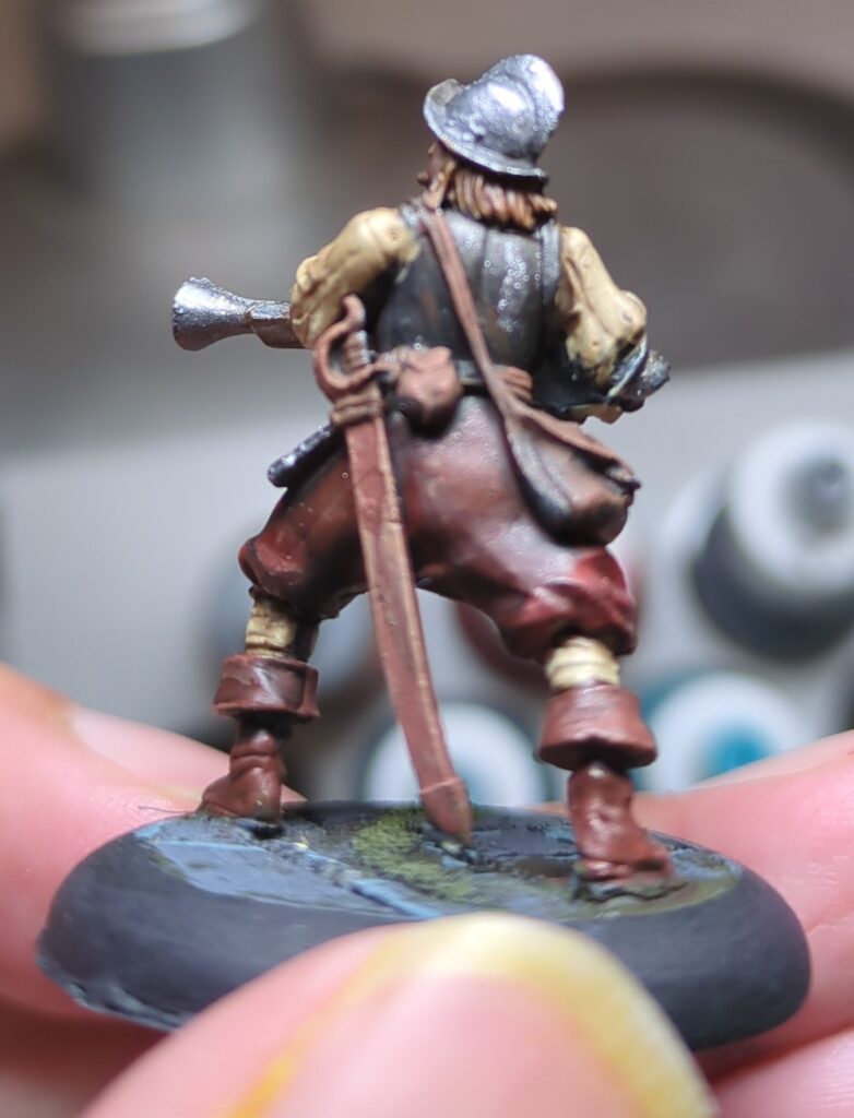 A Hell Dorado Westerners figurine, holding a blunderbus. Viewed from the back some details still need to be painted.