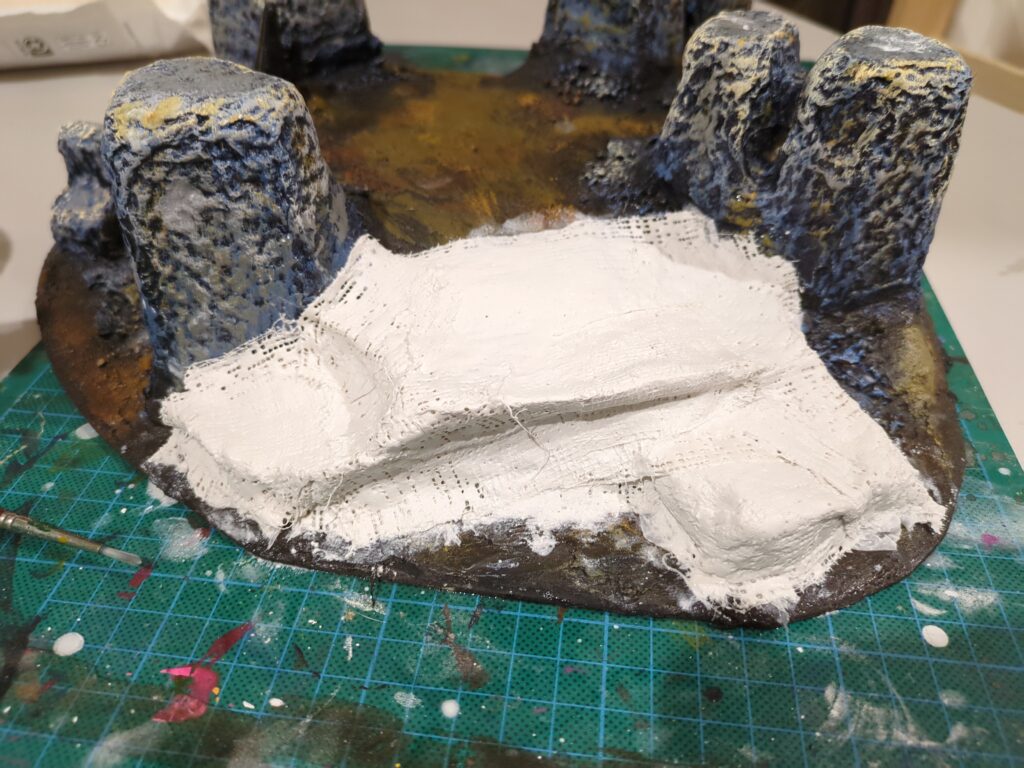 A close up of another side of the plaster mountain, fresh plaster has been added to this side too, creating another series of ledges.