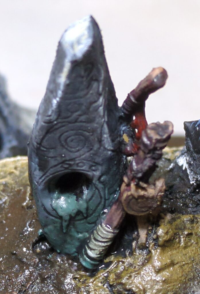 Close up shot of the cairn atop the mountain, showing the simple but effective paint job on it.